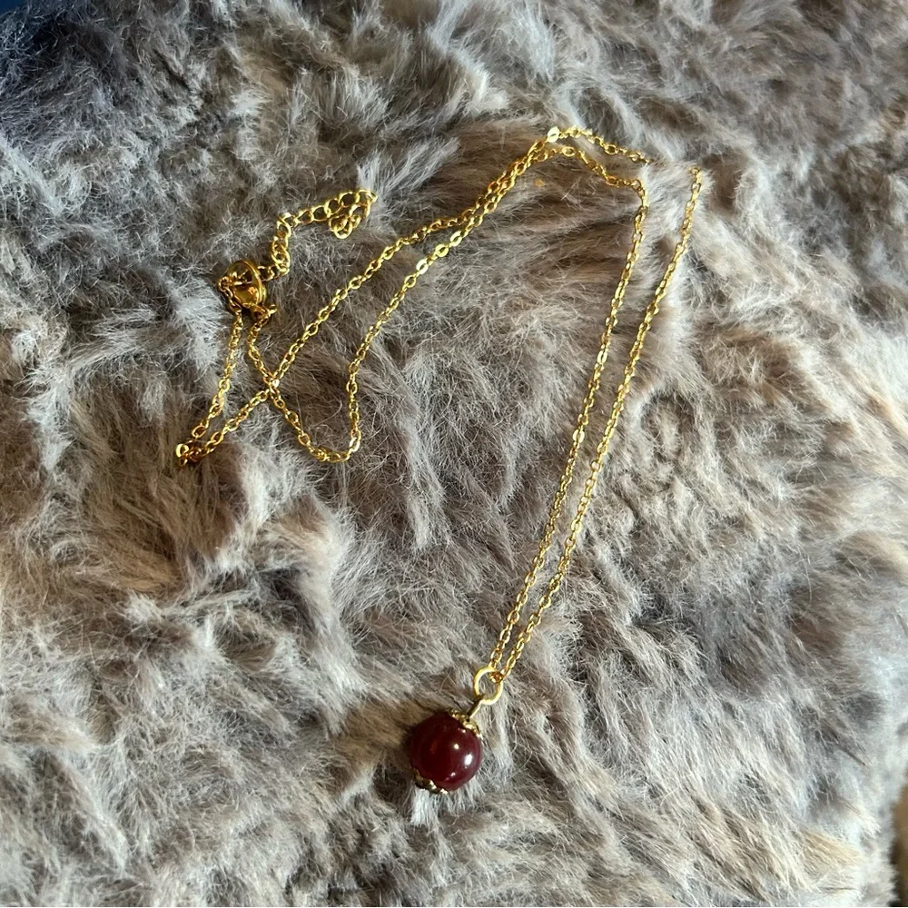 Handcrafted vintage bead capped burgundy glass pendant on chain necklace